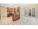 Spacious kitchen features stainless steel appliances, an island, and access to the outdoors at 1039 Ashfern Walk, Woodstock, GA 30189