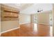 Spacious living room with hardwood floors, modern ceiling fan, and ample natural light at 1039 Ashfern Walk, Woodstock, GA 30189