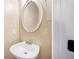 Charming powder room featuring a pedestal sink and decorative mirror at 1039 Ashfern Walk, Woodstock, GA 30189