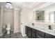 Elegant bathroom featuring a double vanity, modern lighting, stylish fixtures, and patterned tile floors at 340 Nail Rd, Mcdonough, GA 30253
