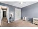 Spacious bedroom featuring neutral walls, carpet flooring, and ample storage, with adjacent rooms visible at 340 Nail Rd, Mcdonough, GA 30253