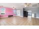 A spacious bonus room with tile floors, ceiling fans, and windows providing natural light, suitable for various activities at 340 Nail Rd, Mcdonough, GA 30253