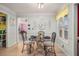 Bright breakfast nook featuring a glass table, decorative chairs, and a large window with natural light at 340 Nail Rd, Mcdonough, GA 30253