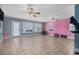 Large room with tile flooring, bright walls, and multiple windows, perfect for various activities at 340 Nail Rd, Mcdonough, GA 30253