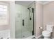 Modern shower with glass doors, sleek fixtures, and tiled walls, providing a spa-like experience at 340 Nail Rd, Mcdonough, GA 30253