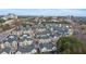 Aerial view of new homes with a city skyline in the distance at 4100 Paces Se Walk # 2205, Atlanta, GA 30339