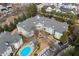 Aerial view of community showcasing buildings, pool, landscaping, and parking at 4100 Paces Se Walk # 2205, Atlanta, GA 30339