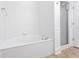 Bright bathroom showcasing a white tub and glass-enclosed shower at 4100 Paces Se Walk # 2205, Atlanta, GA 30339
