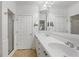 Bathroom with a double vanity sink, a glass shower and ample lighting at 4100 Paces Se Walk # 2205, Atlanta, GA 30339