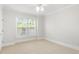 Bright bedroom featuring a large window and neutral carpet at 4100 Paces Se Walk # 2205, Atlanta, GA 30339