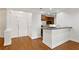 Inviting entry leading to kitchen with hardwood floors and elegant columns at 4100 Paces Se Walk # 2205, Atlanta, GA 30339