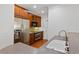 Kitchen with stainless steel appliances, wooden cabinets, and a stylish sink at 4100 Paces Se Walk # 2205, Atlanta, GA 30339