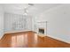 Bright living room features a fireplace, hardwood floors, and large windows at 4100 Paces Se Walk # 2205, Atlanta, GA 30339