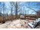 Spacious wooden deck with outdoor seating, grill and wooded views, perfect for relaxing at 5383 Fawn Meadow Ln, Powder Springs, GA 30127