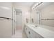 Clean, well-lit bathroom with white cabinets, a spacious counter, and a large mirror at 5383 Fawn Meadow Ln, Powder Springs, GA 30127