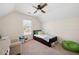 Cozy bedroom with neutral walls, a ceiling fan, and a window letting in natural light at 5383 Fawn Meadow Ln, Powder Springs, GA 30127