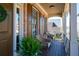 Cozy porch with comfortable seating, a hanging wreath, and verdant potted plants at 5383 Fawn Meadow Ln, Powder Springs, GA 30127