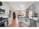 White kitchen that has a view to the dining and living rooms at 5383 Fawn Meadow Ln, Powder Springs, GA 30127