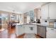 White kitchen that has a view to the dining and living rooms at 5383 Fawn Meadow Ln, Powder Springs, GA 30127