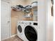 Laundry room with washer, dryer, and storage at 5383 Fawn Meadow Ln, Powder Springs, GA 30127