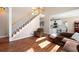 Living room with staircase and open view to the kitchen at 5383 Fawn Meadow Ln, Powder Springs, GA 30127