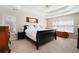 Spacious main bedroom with trey ceiling, neutral carpet, and windows for natural light at 5383 Fawn Meadow Ln, Powder Springs, GA 30127