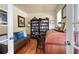 Inviting home office with warm paint, a cozy sofa, and rich wood desk at 5383 Fawn Meadow Ln, Powder Springs, GA 30127