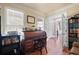 Comfortable office with natural lighting, ample desk space, and hardwood flooring at 5383 Fawn Meadow Ln, Powder Springs, GA 30127