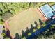 Aerial view of the community sports field next to tennis courts, with ample space for recreational activities at 5383 Fawn Meadow Ln, Powder Springs, GA 30127
