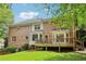 Home exterior with a deck, backyard, and patio at 828 Guinevere Sw Way, Lilburn, GA 30047