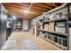 Unfinished basement offering ample storage with shelving units, perfect for organization at 828 Guinevere Sw Way, Lilburn, GA 30047