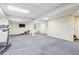 Finished basement with plenty of open space, perfect for customization and various activities at 828 Guinevere Sw Way, Lilburn, GA 30047