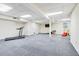 Finished basement featuring ample space for a home gym and recreation area at 828 Guinevere Sw Way, Lilburn, GA 30047