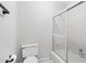 Bathroom featuring a toilet and shower and bath combination at 828 Guinevere Sw Way, Lilburn, GA 30047