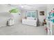 Bright bedroom with day bed, carpeted floors, and ample room for activities at 828 Guinevere Sw Way, Lilburn, GA 30047