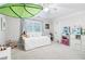 Charming bedroom with day bed, leaf accent, and a ceiling fan at 828 Guinevere Sw Way, Lilburn, GA 30047