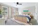 Cozy bedroom with natural light, soft decor, and stylish furniture for a relaxing retreat at 828 Guinevere Sw Way, Lilburn, GA 30047