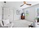 Bright bedroom with plush carpet, a picture window, and plenty of space at 828 Guinevere Sw Way, Lilburn, GA 30047