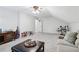 Large bonus room with neutral carpet, a sofa, and a coffee table. Ready for fun! at 828 Guinevere Sw Way, Lilburn, GA 30047