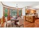 Charming dining room with a bright bay window and a modern light fixture at 828 Guinevere Sw Way, Lilburn, GA 30047