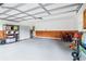 Spacious garage with storage cabinets, utility sink, and overhead door at 828 Guinevere Sw Way, Lilburn, GA 30047