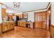 Spacious kitchen with wood cabinets, stainless steel appliances, and a convenient work area at 828 Guinevere Sw Way, Lilburn, GA 30047