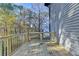 Wooden back deck that overlooks a lush forest, perfect for outdoor enjoyment at 1285 Cedar Brook Dr, Lawrenceville, GA 30043