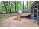 Cozy backyard with gravel, stepping stones, and a storage shed, perfect for outdoor relaxation and storage solutions at 1438 Ridgeland Sw Ct, Lilburn, GA 30047