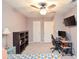 This cozy bedroom features a ceiling fan and plenty of space for a desk and bookcases at 1438 Ridgeland Sw Ct, Lilburn, GA 30047