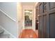 Entry hall with hardwood floors leading to kitchen with skylight at 1438 Ridgeland Sw Ct, Lilburn, GA 30047