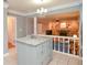 Open-concept kitchen with granite countertops, an island, and a partial view of the living room and fireplace at 1438 Ridgeland Sw Ct, Lilburn, GA 30047