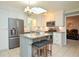 Modern kitchen featuring stainless steel appliances, granite countertops, a center island, and ample cabinet space at 1438 Ridgeland Sw Ct, Lilburn, GA 30047