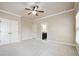 Bedroom featuring plush carpet, ceiling fan, ensuite bathroom, and closet at 1655 Dawn Dr, Suwanee, GA 30024