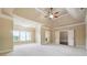 Spacious bedroom features vaulted ceiling, plush carpet, and windows at 1655 Dawn Dr, Suwanee, GA 30024